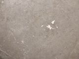 a close up view of a dirty pan with a spatula on it