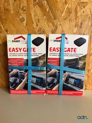three boxes of easy gate for cars on a table