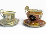 deux tasses et soucoupes posées l'une à côté de l'autre