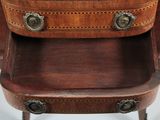 a wooden table with a suitcase on top of it