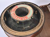 an old tin can sitting on a table next to a box