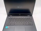 a laptop with a keyboard on it sitting on a table