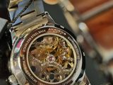 a close up of a watch on a table