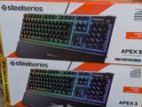 two boxes of computer keyboards on display for sale