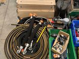 many different types of hoses and other items on the ground
