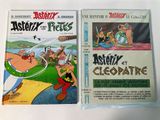 two cartoon books are sitting on a white surface