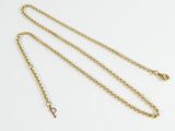 a gold chain necklace with a heart charm on a white background