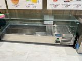 a display case that has a lot of food on it
