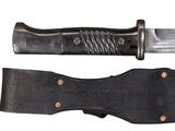 a knife that is laying on top of a knife holder