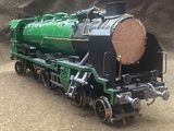 a toy train that is sitting on the tracks