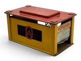 a small yellow mail box with a red lid