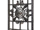 an image of a metal gate with a decorative design on it