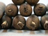 a pile of wooden stamps that have been carved into them