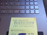 a note on the keyboard of a laptop computer