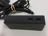 an image of a black charger with a cord connected to it