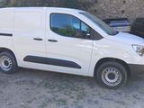 a picture of a white van parked in a parking lot