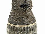 a ceramic bear that is sitting in a vase