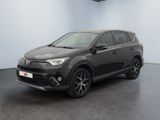 a grey toyota rav parked in a garage