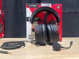 a pair of headphones sitting on top of a wooden table