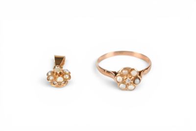 an image of two gold rings and a pearl pendant