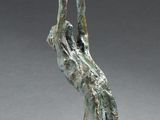 a bronze sculpture of a woman holding a bowl on her head