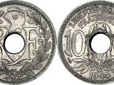 a close up of two silver coins on a white background