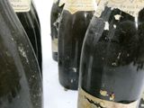 several bottles of wine are lined up on a table