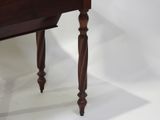 a wooden table with a drawer on top of it