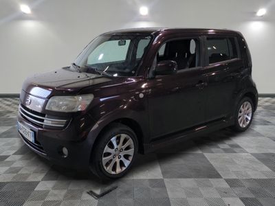 a picture of a dark colored vehicle parked in a garage