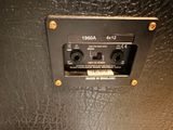 a close up of a black speaker on a black surface