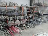 many different types of steel rods in a warehouse
