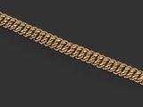 un bracelet à chaîne en or avec un fermoir sur fond noir