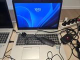 two laptops that are sitting on a table