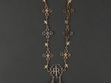 necklace with a cross and a cross pendant on a chain
