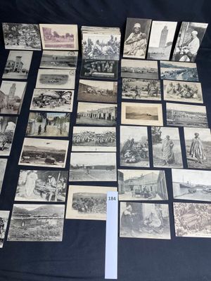 several old black and white photographs of people and buildings