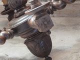 a candle holder that is sitting on the ground