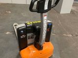 an orange and black electric forklift sitting on a concrete floor