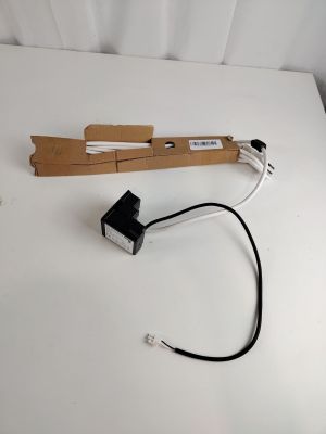 a piece of cardboard with a wire attached to it