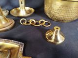a lot of brass items that are on a table