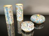 three vases sitting next to each other on a table