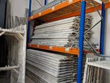 a lot of shelves in a warehouse with a lot of items on them