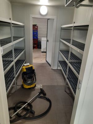 a vacuum that is on the floor in a room