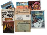 a lot of comic books that are on the table