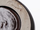 a close up of a plate with a black and white design on it