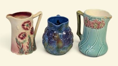 three vases sitting next to each other on a white surface