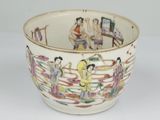 a white bowl with a picture of people on it