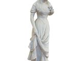 marble statue of a woman holding a flower on a pedestal