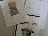 three pages of manuals on a table with a table sawing machine