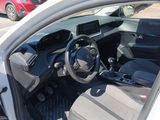 a car that is sitting in a parking lot with its door open