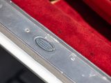 a close up of a red case with a silver handle